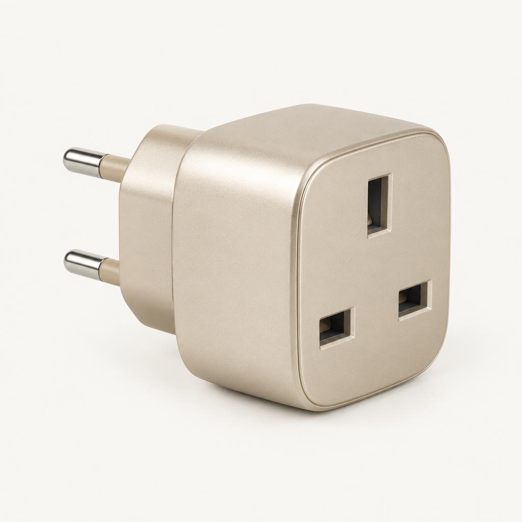 Compact EU to UK travel plug adapter in champagne